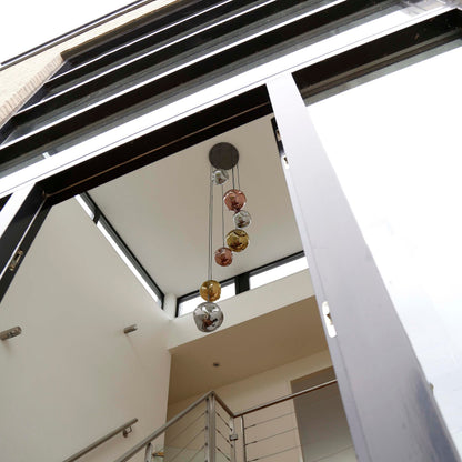 Elaris Pendelleuchte – 7‑teilige Metall‑Farbkombination in Gold, Kupfer und Chrom