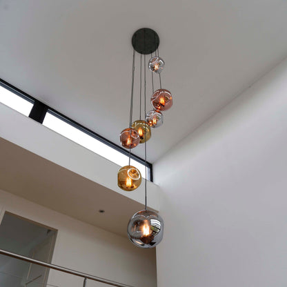 Elaris Pendelleuchte – 7‑teilige Metall‑Farbkombination in Gold, Kupfer und Chrom