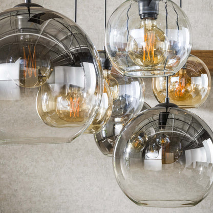 Luxusbetten24 Olivara Pendelleuchte 7‑gläserne Schirme Bernstein Chrom Hellgrau