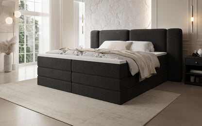 Luxusbetten24 Leni Boxspringbett mit hochklappbarem Stauraum in Teddy Bouclé
