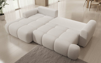 Luxusbetten24 Analfi L Sofa mit Schlaf‑Klappfunktion in Bouclé