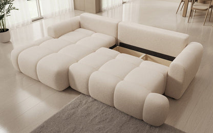 Luxusbetten24 Analfi L Sofa mit Schlaf‑Klappfunktion in Bouclé