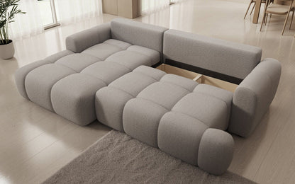 Luxusbetten24 Analfi L Sofa mit Schlaf‑Klappfunktion in Bouclé